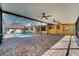 Covered outdoor pool area with brick flooring, ceiling fans and a relaxing atmosphere at 1775 Druliner Rd, St Cloud, FL 34771