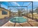 Inviting screened-in pool with brick pavers, perfect for swimming and enjoying the outdoors at 1775 Druliner Rd, St Cloud, FL 34771