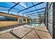 Backyard pool with screened enclosure and brick paver patio at 1775 Druliner Rd, St Cloud, FL 34771