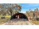 Quonset hut provides covered storage or workshop space, adding versatility to the property at 1775 Druliner Rd, St Cloud, FL 34771