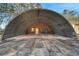 Large Quonset hut with concrete pad and metal roof provides ample storage or workspace at 1775 Druliner Rd, St Cloud, FL 34771