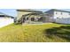 Backyard featuring a pool, hot tub, patio, lawn, and fenced perimeter at 2564 Bullion Loop, Sanford, FL 32771