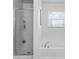 A close-up on the bath, with a bathtub and a glass door shower at 2564 Bullion Loop, Sanford, FL 32771