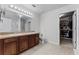 Well-lit bathroom with a dual sink vanity, toilet, and large walk-in closet at 2564 Bullion Loop, Sanford, FL 32771