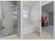 Bathroom features a shower, garden tub, and entrance to the bedroom at 2564 Bullion Loop, Sanford, FL 32771