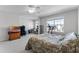 Spacious bedroom featuring a large window, ceiling fan, and area for a home office and exercise equipment at 2564 Bullion Loop, Sanford, FL 32771