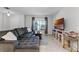 Comfortable living room featuring a large sectional sofa and a large window at 2564 Bullion Loop, Sanford, FL 32771