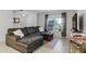 Comfortable living room with sectional sofa and large window at 2564 Bullion Loop, Sanford, FL 32771