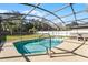 Sparkling pool and spa in screened enclosure offers outdoor enjoyment at 2564 Bullion Loop, Sanford, FL 32771