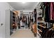 Organized walk-in closet with shelving, hanging rods, and ample storage space at 2564 Bullion Loop, Sanford, FL 32771