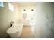 Modern bathroom with a freestanding tub, double vanities with black hardware, and bright natural light at 2629 Sw 163Rd Pl, Ocala, FL 34473