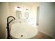 Modern bathroom with double vanities with black hardware and freestanding tub at 2629 Sw 163Rd Pl, Ocala, FL 34473
