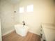 Modern bathroom featuring a freestanding tub, a glass-enclosed shower with white marble tile, and white cabinetry at 2629 Sw 163Rd Pl, Ocala, FL 34473