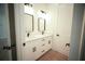 Modern bathroom featuring a double sink vanity, quartz counters, and dark hardware at 2629 Sw 163Rd Pl, Ocala, FL 34473