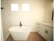 Modern bathroom featuring a walk-in shower with white marble tile and a freestanding tub at 2629 Sw 163Rd Pl, Ocala, FL 34473