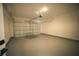 A clean and empty garage with a light gray epoxy floor at 2629 Sw 163Rd Pl, Ocala, FL 34473