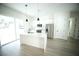 Modern kitchen featuring an island, stainless steel appliances, and bright, neutral finishes at 2629 Sw 163Rd Pl, Ocala, FL 34473