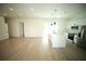 Modern kitchen with white cabinets, stainless steel appliances, and island with pendant lighting at 2629 Sw 163Rd Pl, Ocala, FL 34473