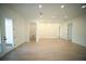 Bright, open-concept living room with light wood flooring and neutral paint at 2629 Sw 163Rd Pl, Ocala, FL 34473