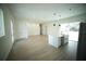 Spacious open-concept living room and kitchen area with stainless steel appliances and modern finishes at 2629 Sw 163Rd Pl, Ocala, FL 34473