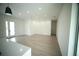 Spacious open-concept living room with recessed lighting, neutral walls, and light wood-look flooring at 2629 Sw 163Rd Pl, Ocala, FL 34473
