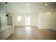 Bright living room with light wood flooring and a view of the front entrance at 2629 Sw 163Rd Pl, Ocala, FL 34473