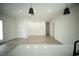 Bright open living space with recessed lighting, modern pendant lights, and light wood-look flooring at 2629 Sw 163Rd Pl, Ocala, FL 34473