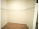 Walk-in closet with wire shelving and light wood-look flooring at 2629 Sw 163Rd Pl, Ocala, FL 34473