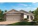 Charming single-story home with a two-car garage, stone accents, and a well-manicured front lawn at 323 Sequoia Dr, Lake Wales, FL 33859