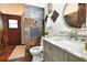 Bathroom boasts stylish tile accents, a modern vanity with sink, and sleek fixtures at 4178 S Chickasaw Trl, Orlando, FL 32829