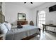 Inviting bedroom with cozy furniture, stylish decor, and a bright arched window at 4178 S Chickasaw Trl, Orlando, FL 32829