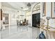 Elegant entryway features soaring ceilings, decorative chandelier, and a glimpse into the dining area at 4178 S Chickasaw Trl, Orlando, FL 32829