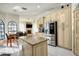 Open-concept kitchen features stainless-steel appliances, granite countertops, and a central island at 4178 S Chickasaw Trl, Orlando, FL 32829