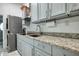 Close up on a well-organized laundry room with granite countertops and modern appliances at 4178 S Chickasaw Trl, Orlando, FL 32829