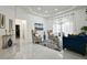 Living room boasts high ceilings, stylish furnishings, and ample natural light from the French doors at 4178 S Chickasaw Trl, Orlando, FL 32829
