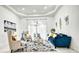 Bright living room boasts high ceilings, stylish furnishings, and ample natural light from the French doors at 4178 S Chickasaw Trl, Orlando, FL 32829
