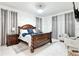 Elegant main bedroom with a large bed, decorative side tables, and sitting area at 4178 S Chickasaw Trl, Orlando, FL 32829