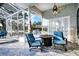 Outdoor patio with comfortable seating, ceiling fan, and stone flooring at 4178 S Chickasaw Trl, Orlando, FL 32829