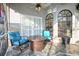Cozy outdoor seating area on a screened-in patio with decorative stone flooring at 4178 S Chickasaw Trl, Orlando, FL 32829