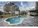 Backyard pool area with in-ground pool, screen enclosure and outdoor seating at 4178 S Chickasaw Trl, Orlando, FL 32829