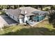 Aerial view showcasing a screened-in pool and outdoor patio area, perfect for entertaining guests at 4178 S Chickasaw Trl, Orlando, FL 32829