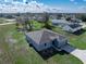 Aerial view of a home featuring a gray exterior, spacious yard and surrounding area at 429 Ohio Way, Kissimmee, FL 34759