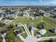 Aerial view of several homes in a community, showcasing their location amidst a scenic, green landscape at 429 Ohio Way, Kissimmee, FL 34759