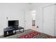 Relaxing bedroom with closet, bathroom access, and minimalistic decor for calm at 429 Ohio Way, Kissimmee, FL 34759