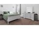 Bedroom with white furniture, neutral carpet, and a bright window at 429 Ohio Way, Kissimmee, FL 34759
