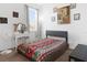Inviting bedroom features a large window, stylish decor, and comfortable furnishings at 429 Ohio Way, Kissimmee, FL 34759