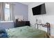 Bedroom with modern furniture, bright window, TV and desk at 429 Ohio Way, Kissimmee, FL 34759