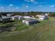 View of several homes in a community with lush grass and a blue sky with scattered clouds at 429 Ohio Way, Kissimmee, FL 34759