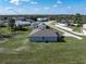 Back view of house featuring a well-maintained lawn, ideal for outdoor activities and relaxation at 429 Ohio Way, Kissimmee, FL 34759