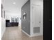 Hallway featuring neutral tile flooring and an open view into the living room area at 429 Ohio Way, Kissimmee, FL 34759